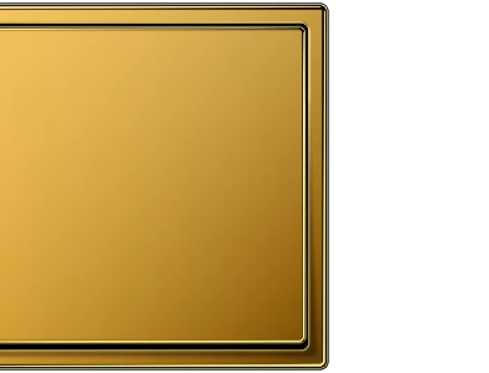 Ein quadratischer Lichtschalter der Serie LS-990 von JUNG in glänzendem Goldton, mit einem schlichten, modernen Design und leicht abgerundeten Kanten.